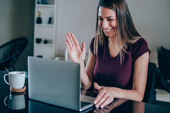 Woman smiling at laptop