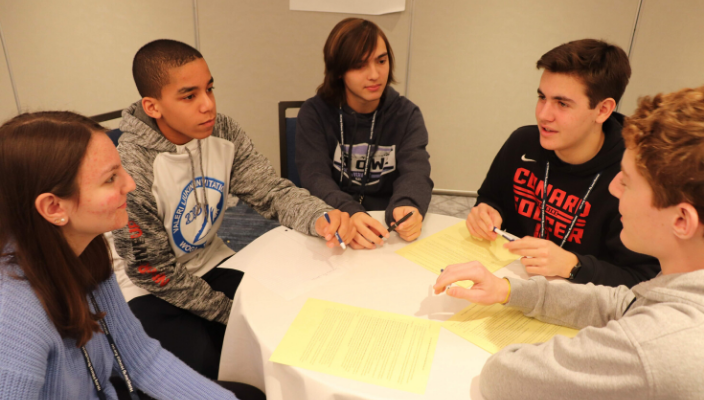 students sitting around a table